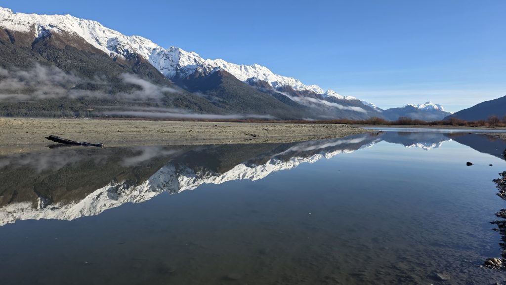 Mountain Range reflecting in the water in Glenorchy