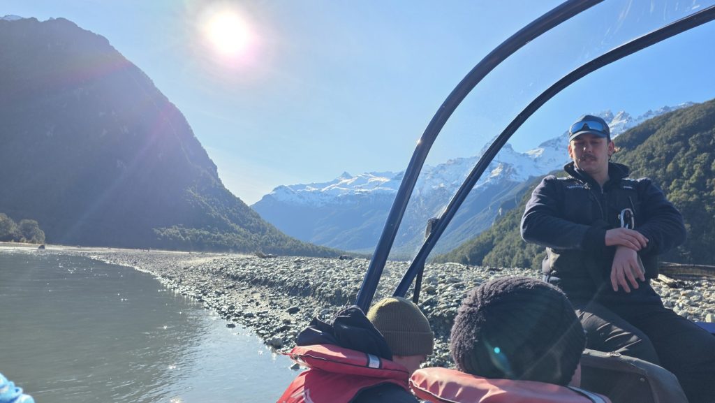 Guide explaining the National park during Dart River jetboat tour in Glenorchy